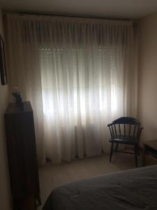 A bed or beds in a room at A CASA DE TOXO