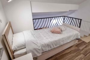 a bedroom with a bed with a pillow on it at Studio in Stara Baska/Insel Krk 34427 in Stara Baška