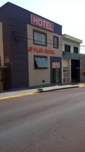a hotel on the side of a road at JF Flat - Hotel in Ribeirão Preto