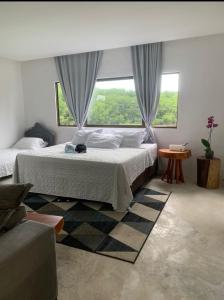 Postel nebo postele na pokoji v ubytování Casa Milagres do Rio