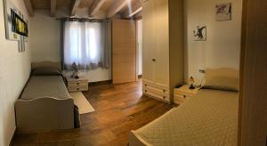 a bedroom with two beds and a window at B&B Casa Vacanza Centro Sardegna in Sorgono +30 photos