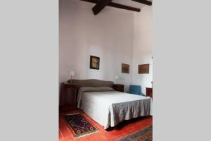 Krevet ili kreveti u jedinici u objektu Casale Alessandra, villa storica della Maremma