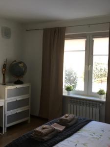Posteľ alebo postele v izbe v ubytovaní Lorin Prestige Apartament