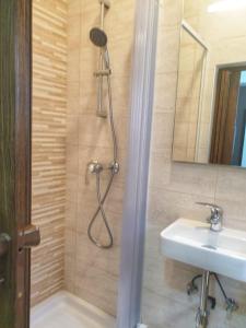 a bathroom with a shower and a sink at Modern Apartment in Central Bugibba in St. Paul's Bay
