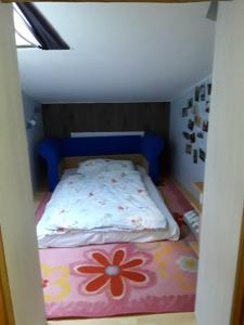 Łóżko lub łóżka w pokoju w obiekcie Ferienwohnung Orchidee
