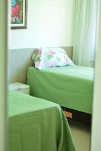 En eller flere senge i et værelse på Marinas Tamandaré