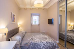 a bedroom with a bed and a window at Villa Flores Room in Dubrovnik