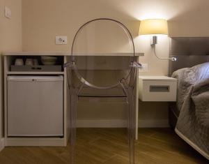 a small room with a mirror and a bed at Villa Flores Room in Dubrovnik