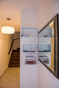 a white refrigerator with a mirror in a room at Villa Flores Room in Dubrovnik