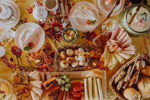 a table filled with food and plates of food at Pousada Lua Clara in Alto Paraíso de Goiás