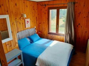 Cama ou camas em um quarto em Chalet du Mont Lozère