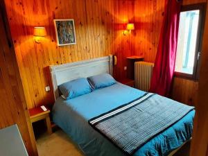 Cama ou camas em um quarto em Chalet du Mont Lozère