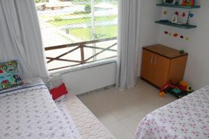 Llit o llits en una habitació de Villa das Águas-reservas