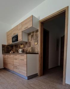 Kuchyň nebo kuchyňský kout v ubytování Apartmány Adieu