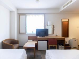 Hotel Wing Port Nagasaki tesisinde bir televizyon ve/veya eğlence merkezi