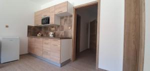 Kuchyň nebo kuchyňský kout v ubytování Apartmány Adieu