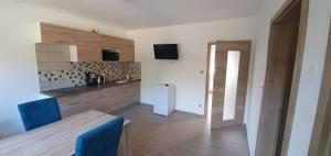 Kuchyň nebo kuchyňský kout v ubytování Apartmány Adieu