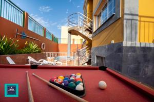 a pool table with balls on top of a building at Inés Apartment, Montaña La Data in San Bartolomé