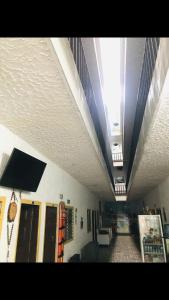 a hallway of a hospital with a room with a ceiling at Hotel Costa Norte in Santa Marta