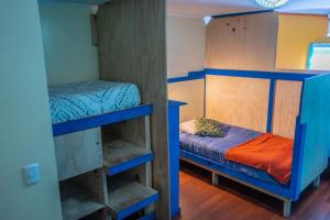 Postel nebo postele na pokoji v ubytování Kapai Hostel
