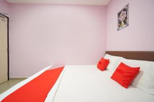 Postel nebo postele na pokoji v ubytování CMN Hotel & Homestay