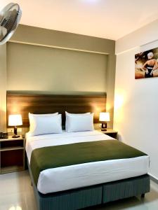 Postel nebo postele na pokoji v ubytování ikala Santa Cruz