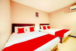 Postel nebo postele na pokoji v ubytování CMN Hotel & Homestay