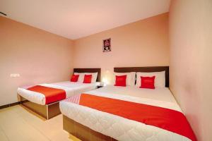 Postel nebo postele na pokoji v ubytování CMN Hotel & Homestay