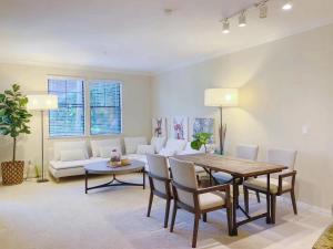 a living room with a table and a couch at Irvine 2Bedroom 2 Bathroom Apartment with Kitchen Pool gym in Irvine