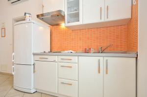 Kuchyň nebo kuchyňský kout v ubytování Apartments Nautilus