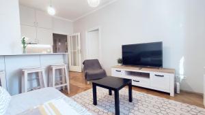 Televízia a/alebo spoločenská miestnosť v ubytovaní Barska 21 by Homeprime