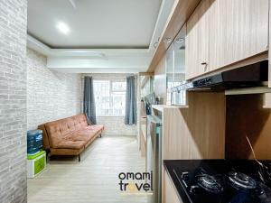 Кухня или мини-кухня в The Jarrdin Apartment by Omami
