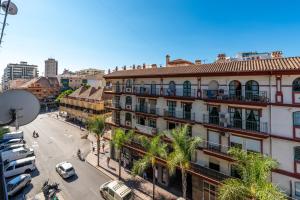 an overhead view of a city street with a building at Apartment Fuengirola City Station in Fuengirola