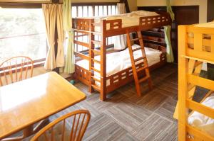 Voodi või voodid majutusasutuse Sakura Guest House toas