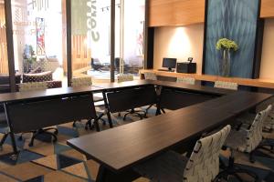 a conference room with tables and chairs in a room at Ewaa Express Hotel - Al Olaya in Riyadh