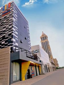 a group of buildings with a tall building at Ewaa Express Hotel - Al Olaya in Riyadh