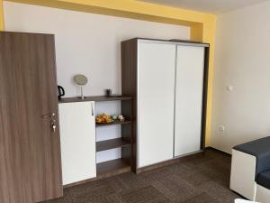 a room with a white door and a shelf at Penzion Teplanka in Považská Bystrica