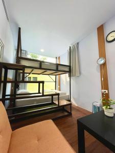 a living room with a bunk bed in a room at 虎山哩賀 Hello-Hu Shan in Rende