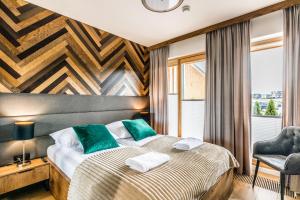 Posteľ alebo postele v izbe v ubytovaní Białka Residence Ski - 100 m do Termy Bania Odkryj-Białke