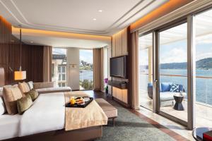 a hotel room with a view of the ocean at Mandarin Oriental Bosphorus, Istanbul in Istanbul