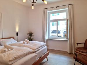 Postel nebo postele na pokoji v ubytování Rosa Rooms Meran