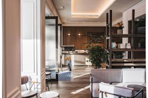 a lobby with chairs and a bar in a building at Page8, Page Hotels in London