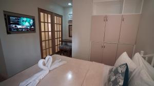a room with a bed with towels on it at 1775 Adriatico Suites in Manila
