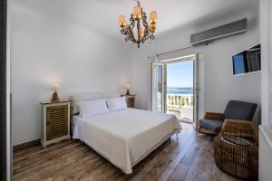 Postel nebo postele na pokoji v ubytování Paros Butterfly Villas + 37 fotografií