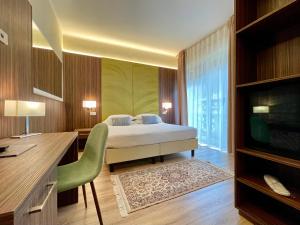 Voodi või voodid majutusasutuse Hotel Brescia toas