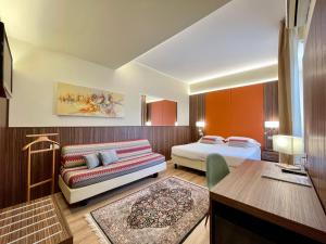 Voodi või voodid majutusasutuse Hotel Brescia toas