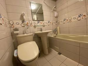 Koupelna v ubytování Kao Feng Hotel