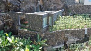 an old building with a train on top of it at Socalco Nature Calheta in Calheta