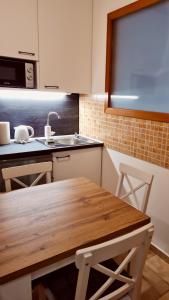 Kuchyň nebo kuchyňský kout v ubytování Ida Apartman + 12 fotografií
