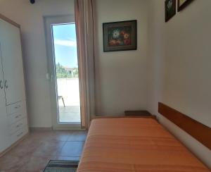 Postel nebo postele na pokoji v ubytování Holiday House Jasna